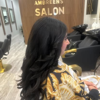 Long black hair finished with soft flowing layers